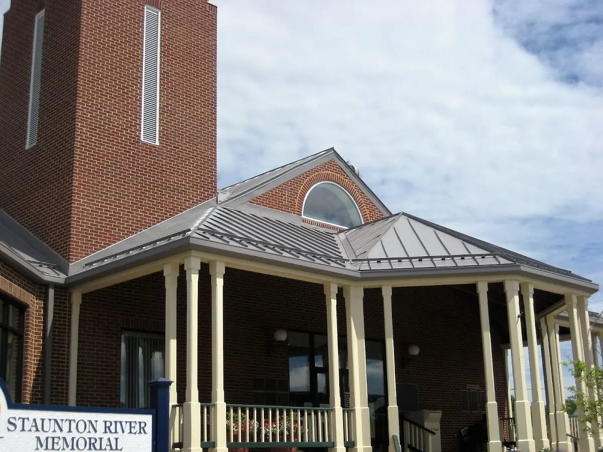 Skilled roofing craftsmen working on a residential roof in Ashburn